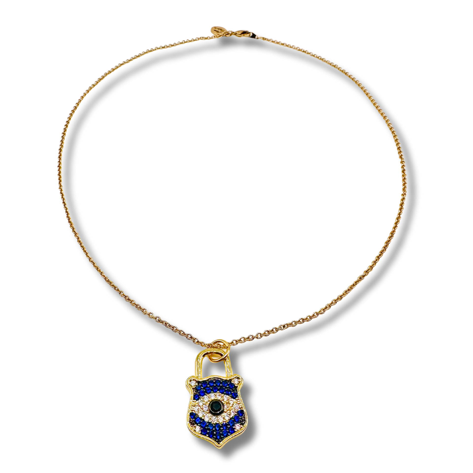Gold necklace with a blue and black pendant on a white background