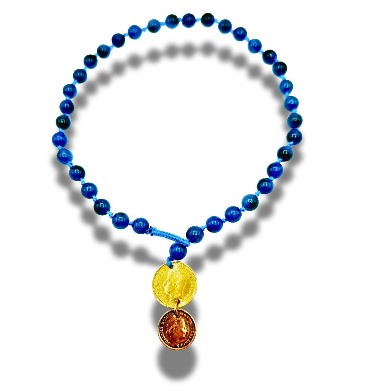 Blue beaded necklace with two coins on a white background