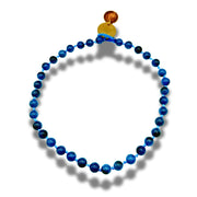 Blue beaded necklace with a coin pendant on a white background