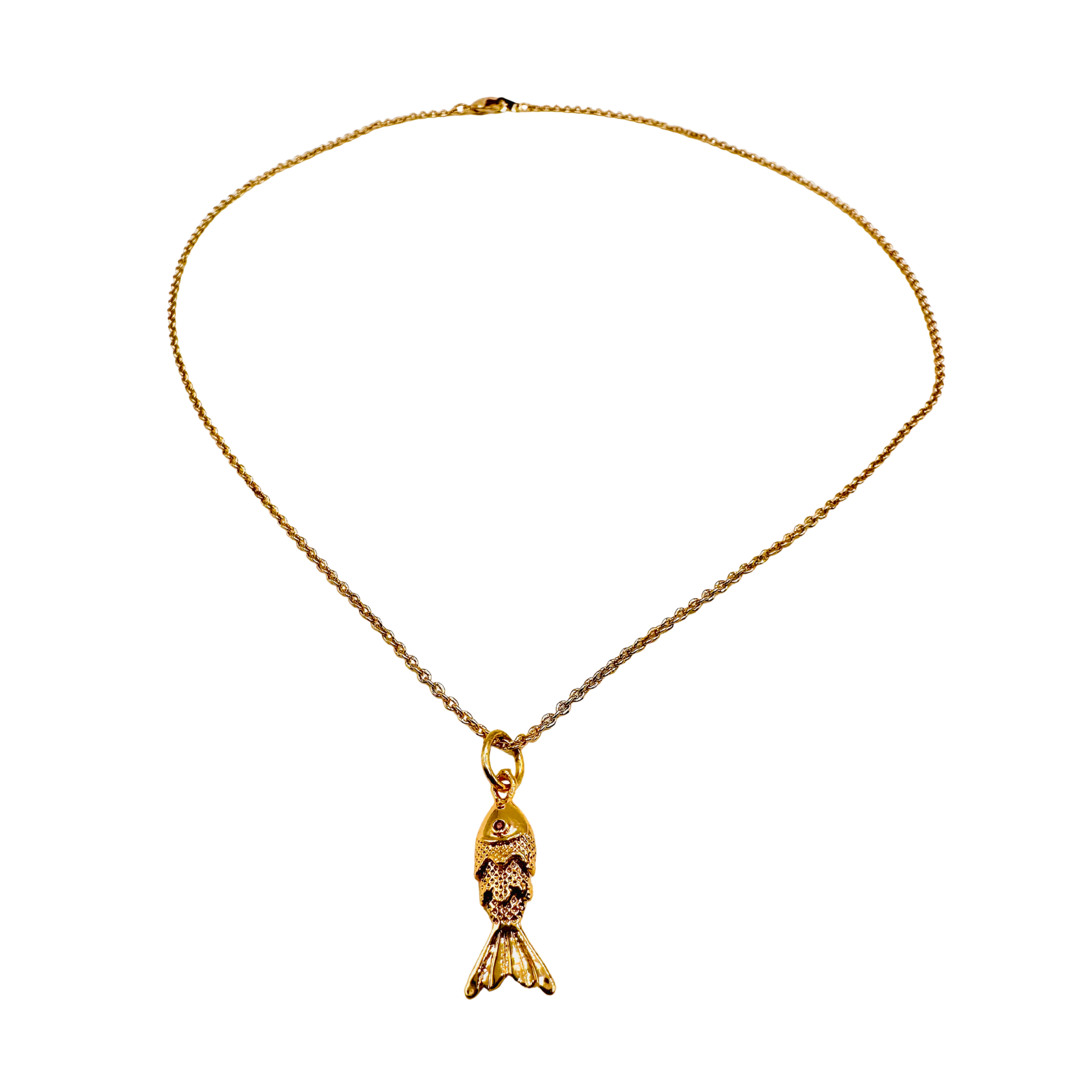 Gold necklace with a fish-shaped pendant on a white background