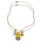 Gold necklace with 'Aloha' pendant on a white background