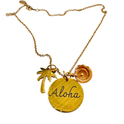 Gold necklace with 'Aloha' pendant, palm tree charm, and flower charm on a white background