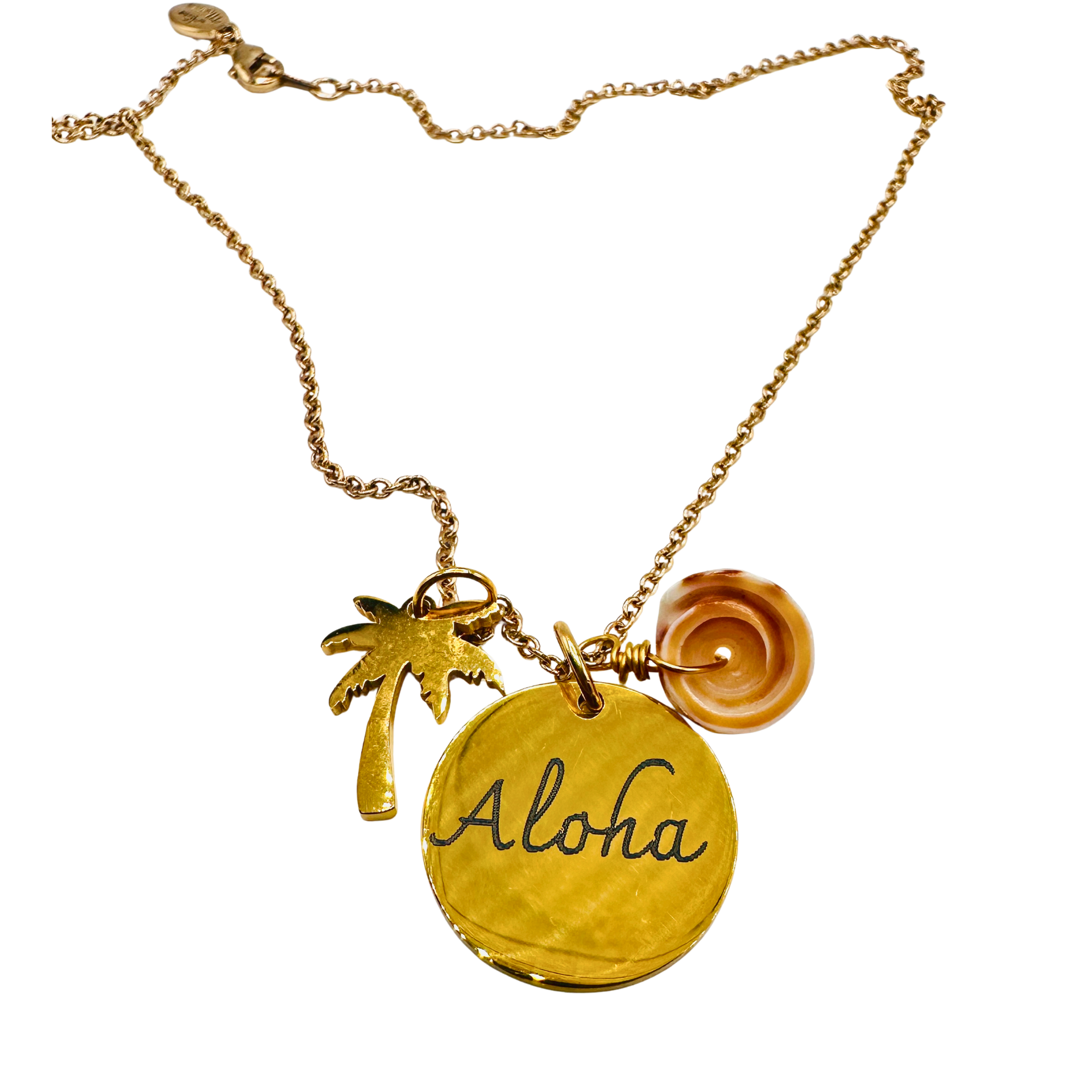 Gold necklace with 'Aloha' pendant, palm tree charm, and flower charm on a white background