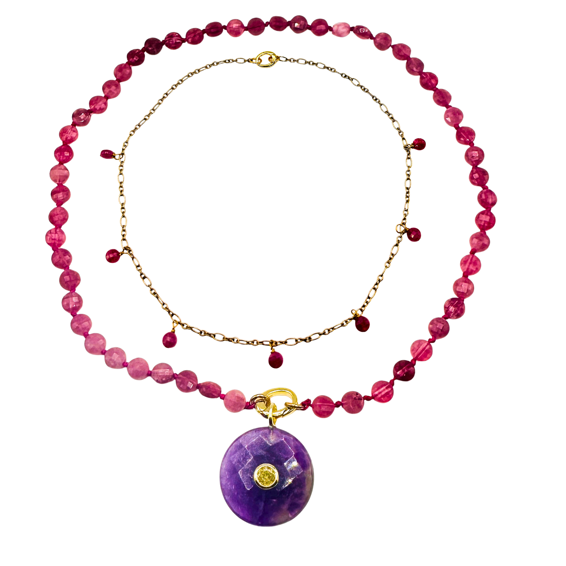Necklace with pink beads and a purple pendant on a white background