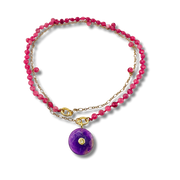 Necklace with pink beads and a purple pendant on a white background