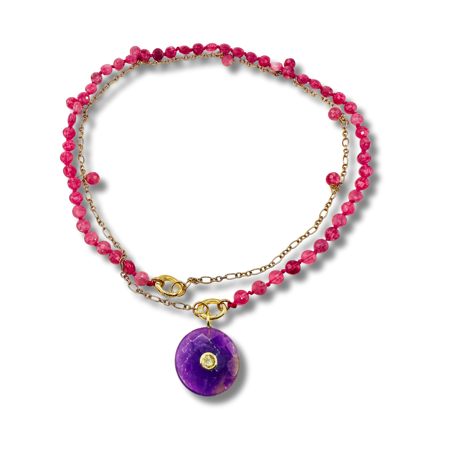 Necklace with pink beads and a purple pendant on a white background