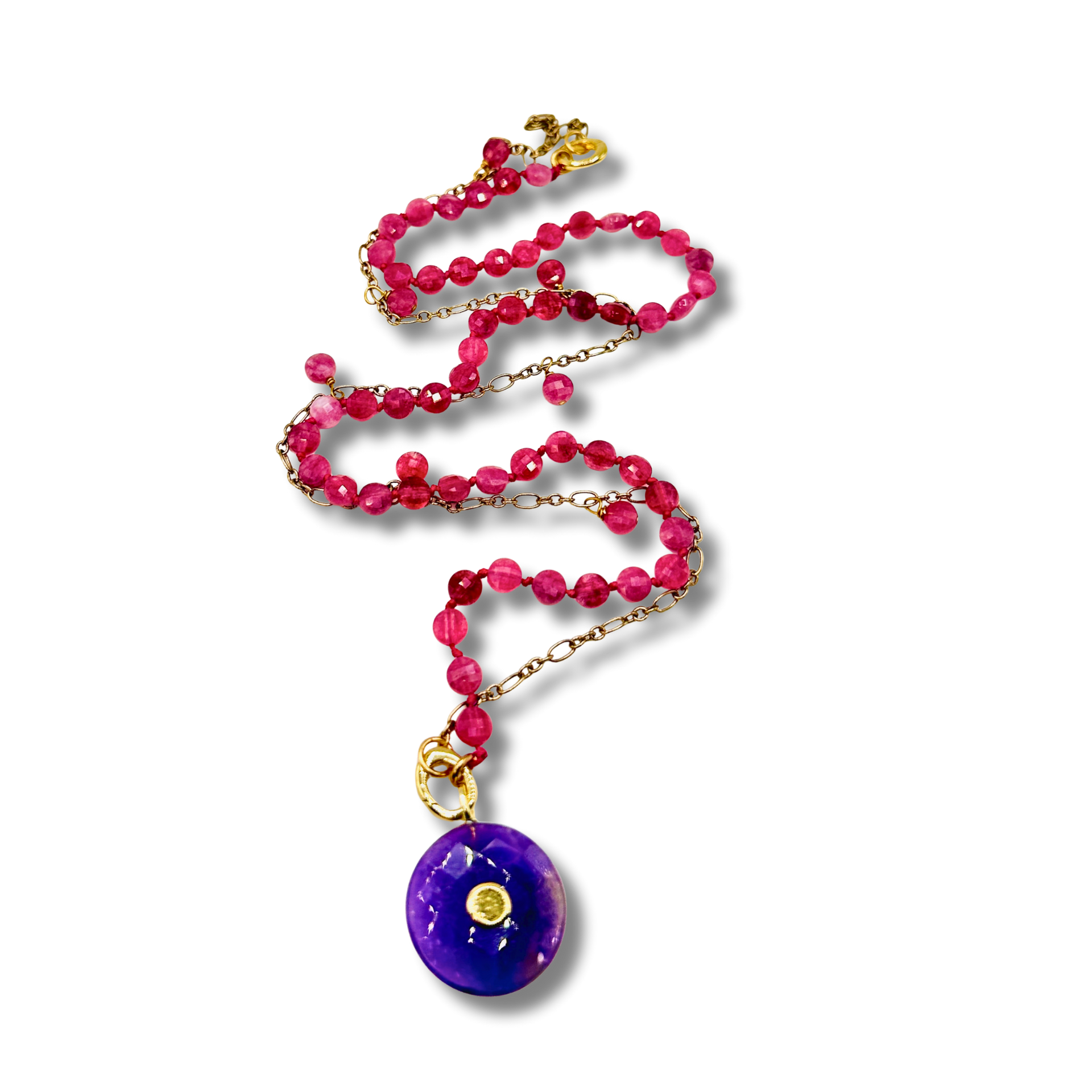 Necklace with pink beads and a purple pendant on a white background