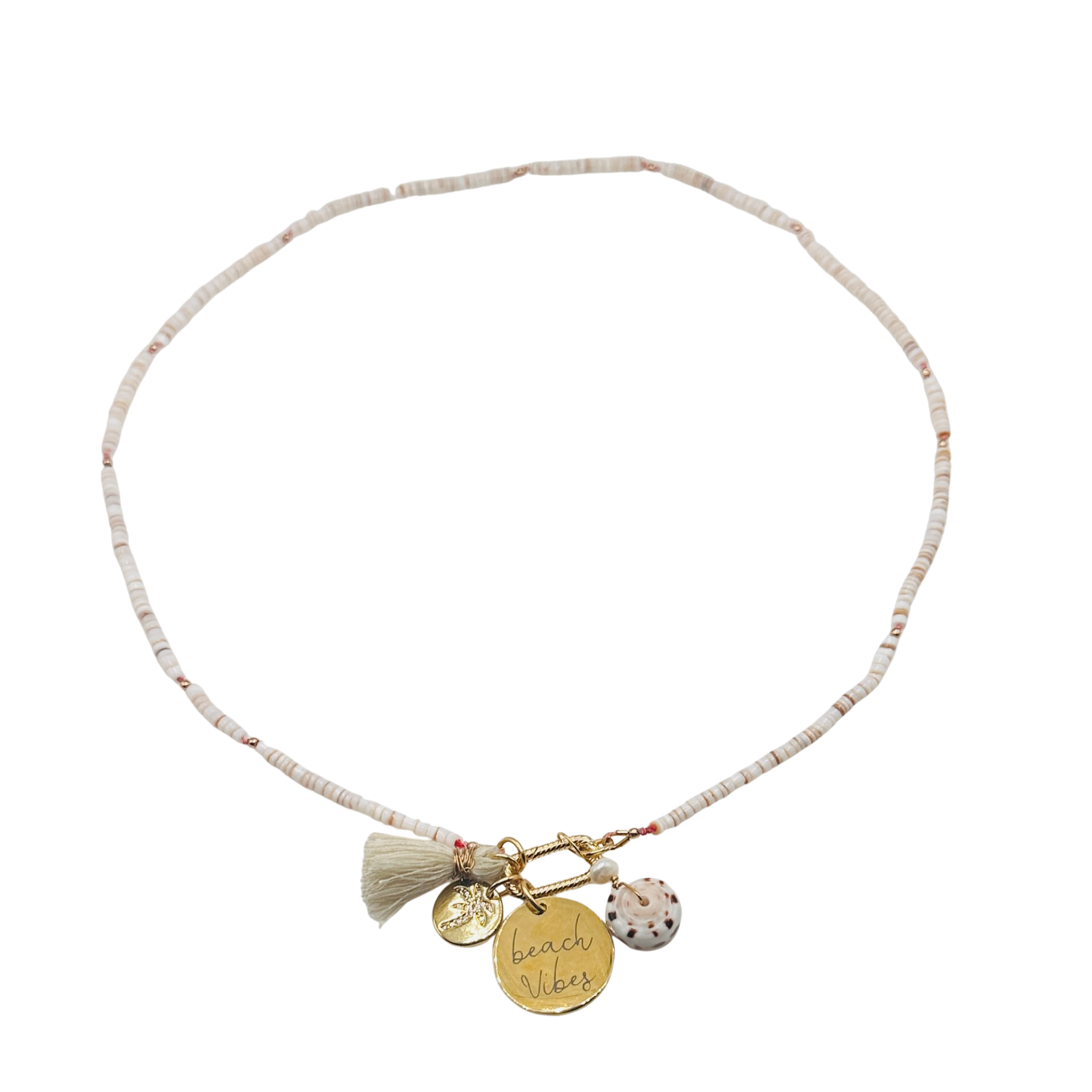 Necklace with tassel and charms on a white background