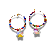 Colorful beaded hoop earrings with star-shaped charms on a white background