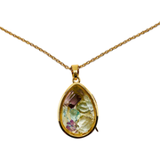 A gold teardrop pendant necklace featuring a multicolored natural gemstone with pink, green, and yellow hues, suspended from a gold chain against a white background.