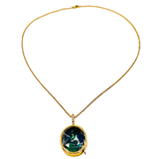 A gold chain necklace with a round pendant featuring a green and blue marbled pattern, set in a gold bezel with a small clear accent stone, shown against a plain white background.