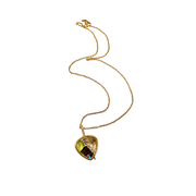 Gold necklace with a teardrop-shaped pendant on a white background