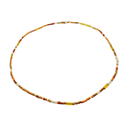 Necklace with yellow beads on a white background