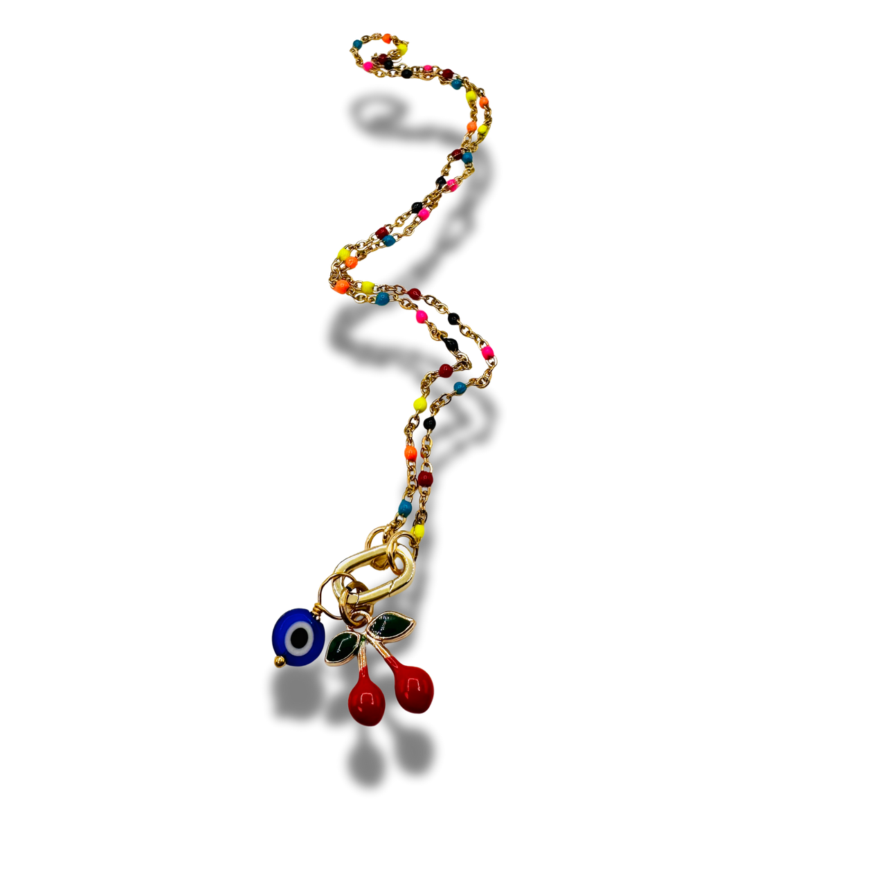 Colorful beaded necklace with a cherries and eye charm on a white background