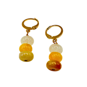 Pair of earrings with gold hooks and multicolored beads on a white background