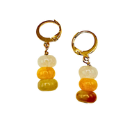 Pair of gold hoop earrings with colorful bead drops on a white background