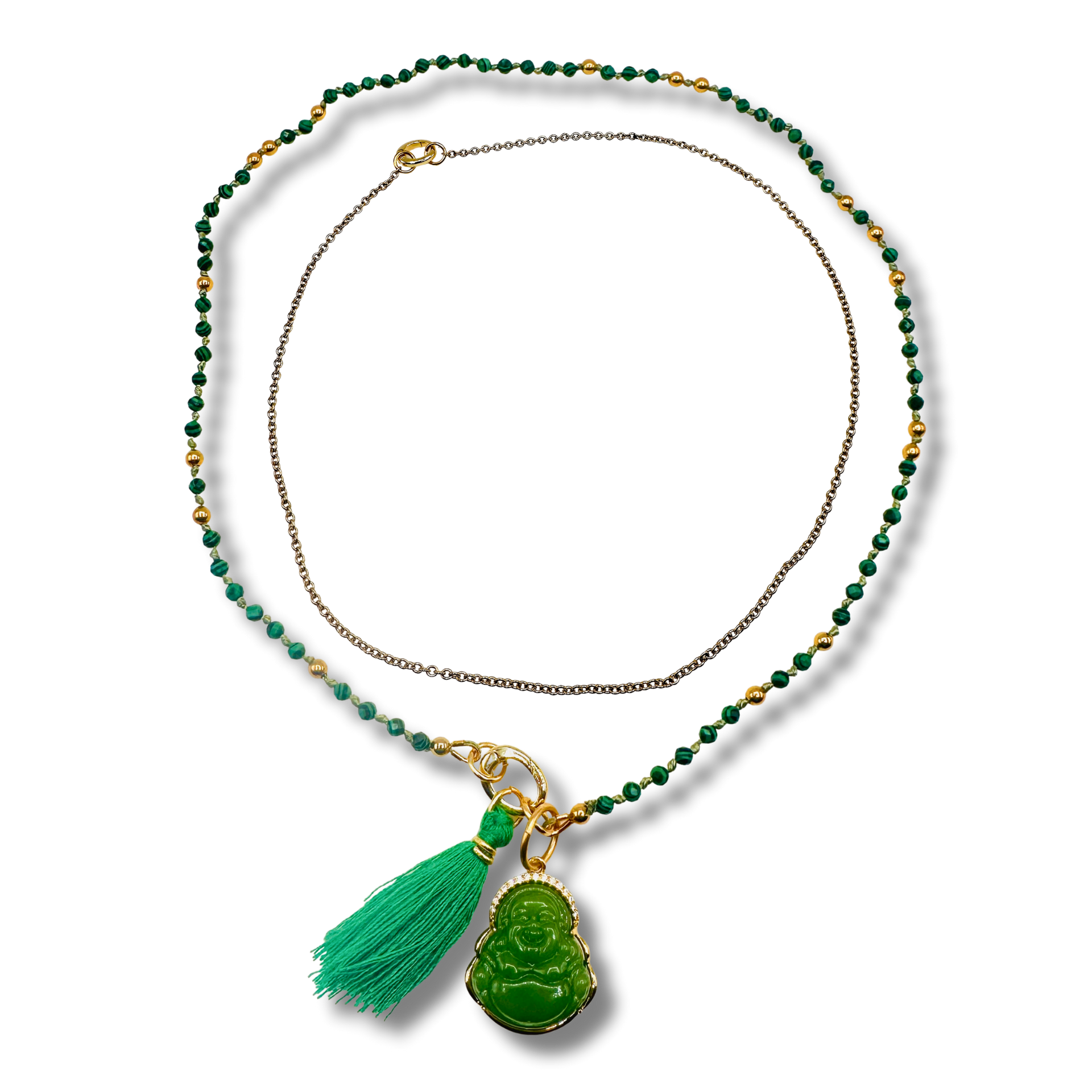 Necklace with green beads and tassel pendant on a white background