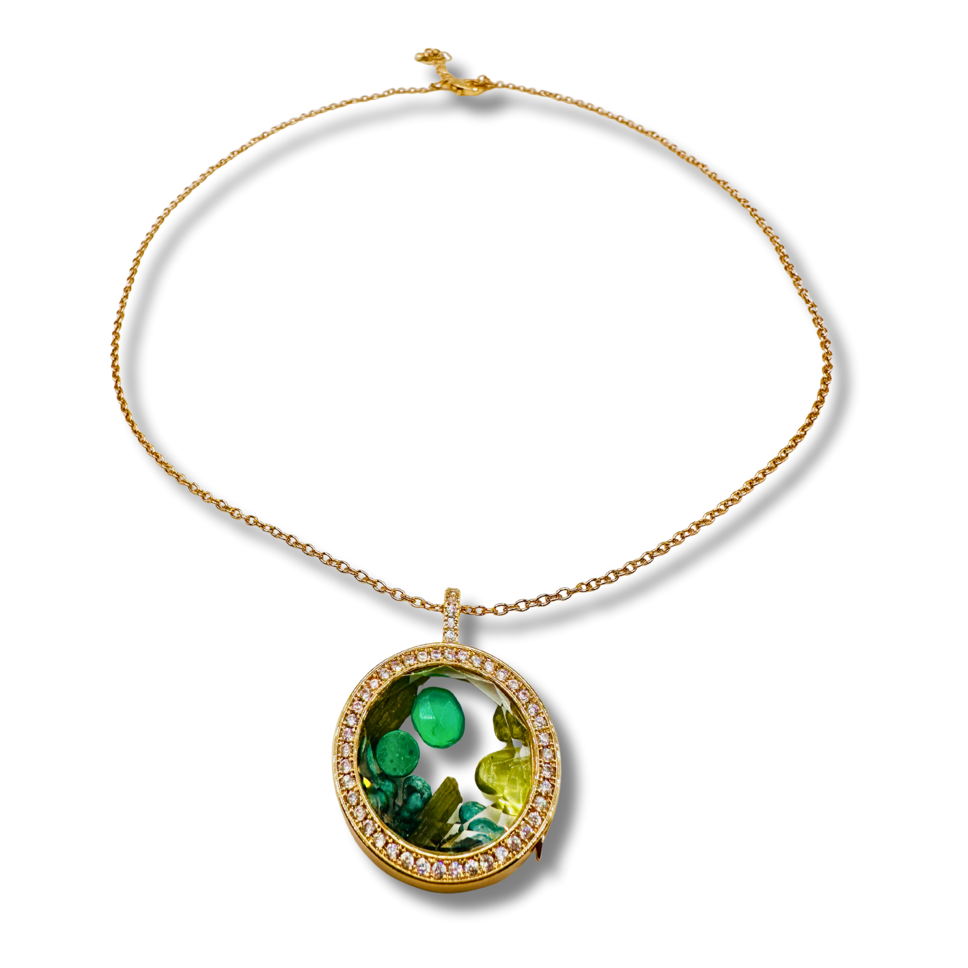 Gold necklace with a green pendant on a white background