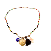 Colorful beaded necklace with various charms on a white background