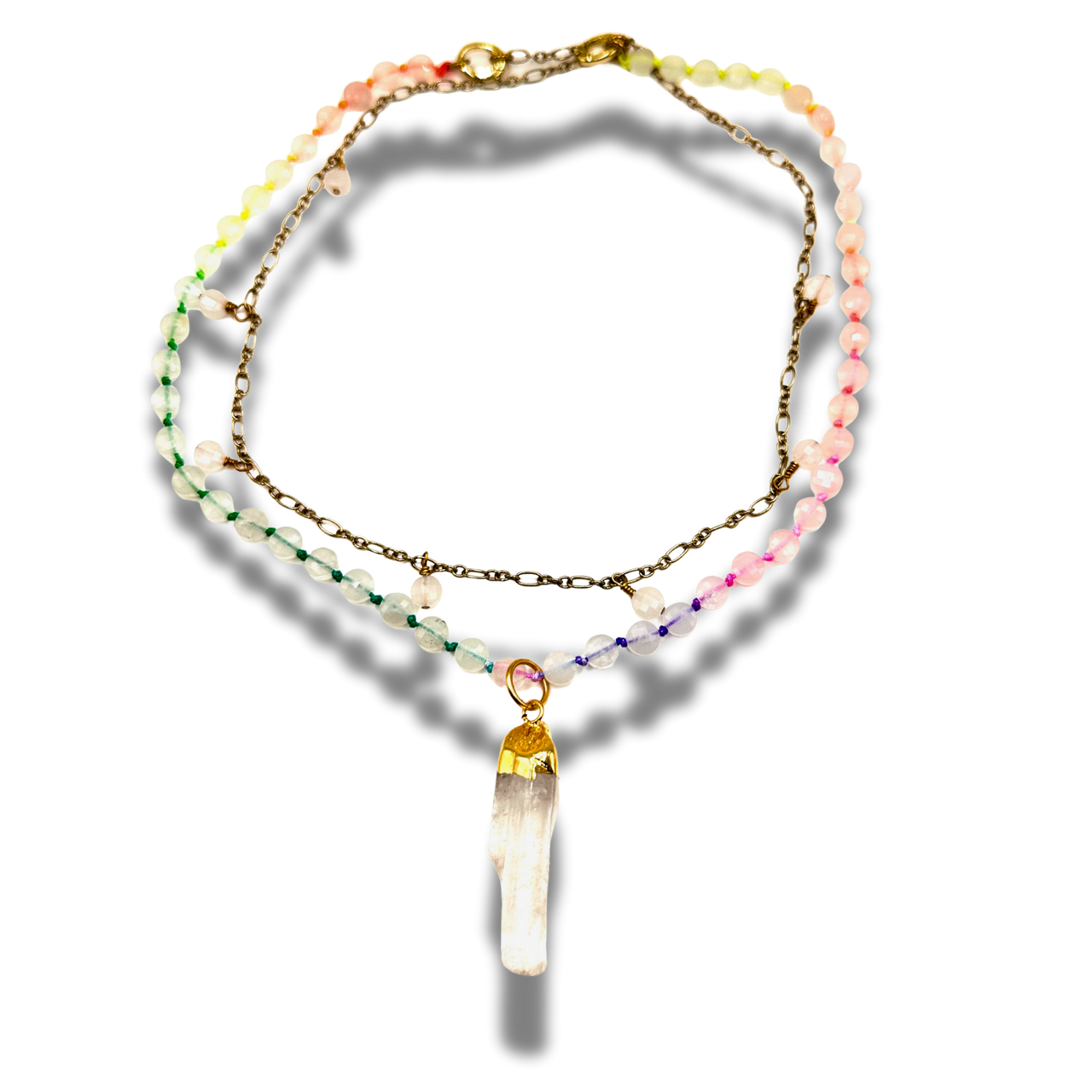 Multistrand beaded necklace with a crystal pendant on a white background