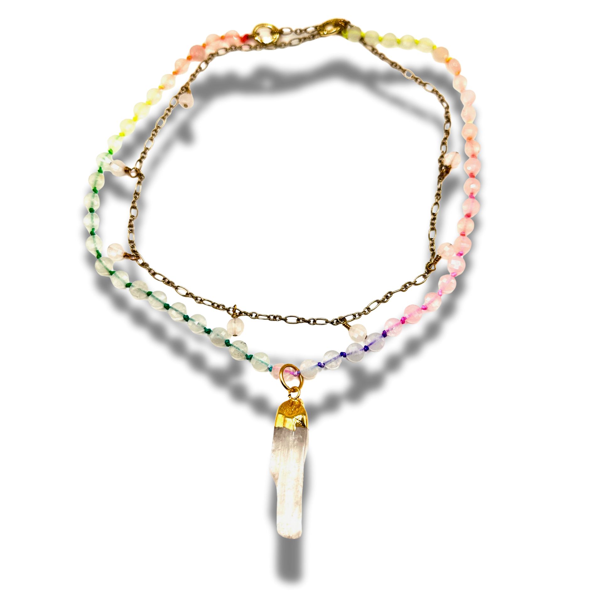 Multistrand beaded necklace with a crystal pendant on a white background