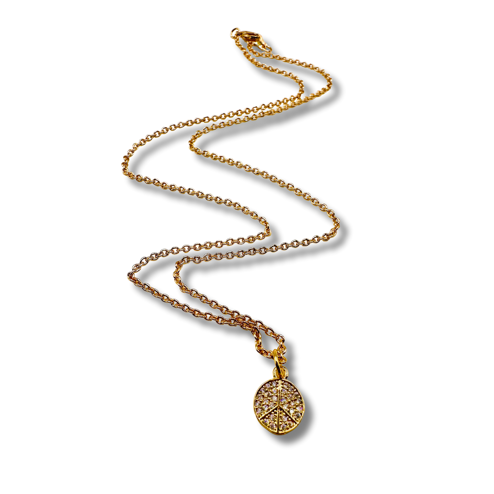 Gold necklace with a round pendant on a white background
