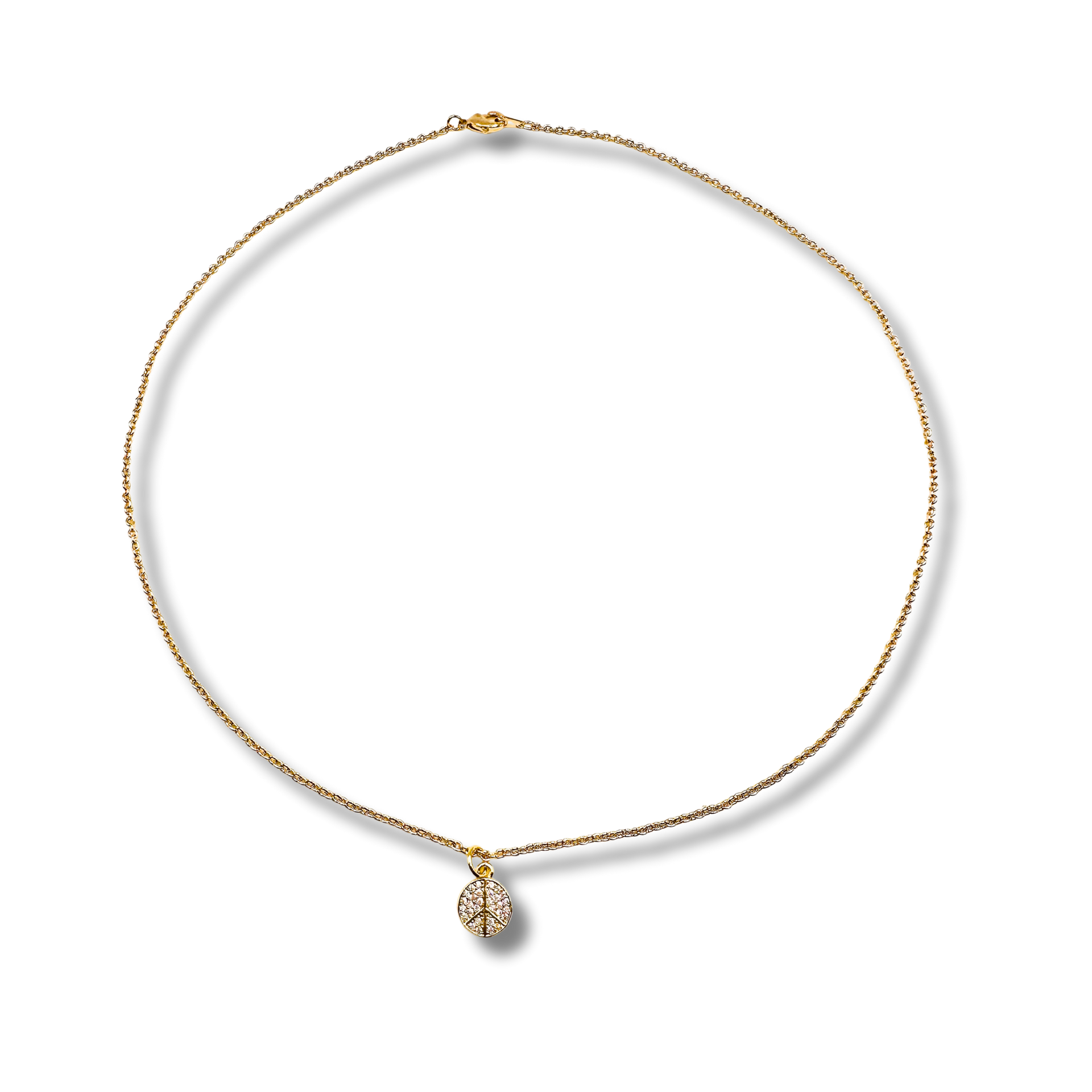 Gold necklace with a teardrop-shaped pendant on a white background
