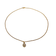 Gold necklace with a small pendant on a white background