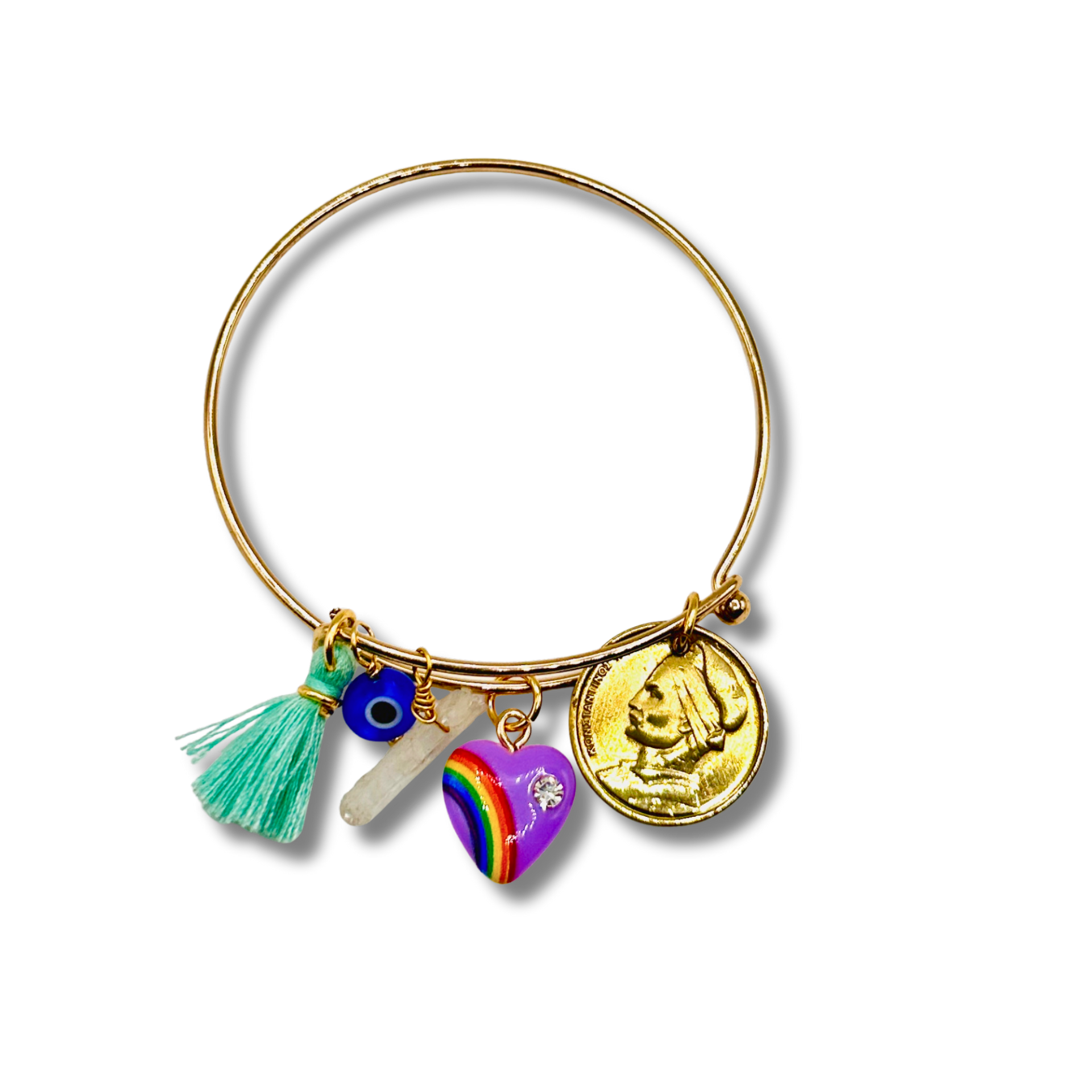 Gold bangle with various charms including a rainbow heart, tassel, and coin on a white background