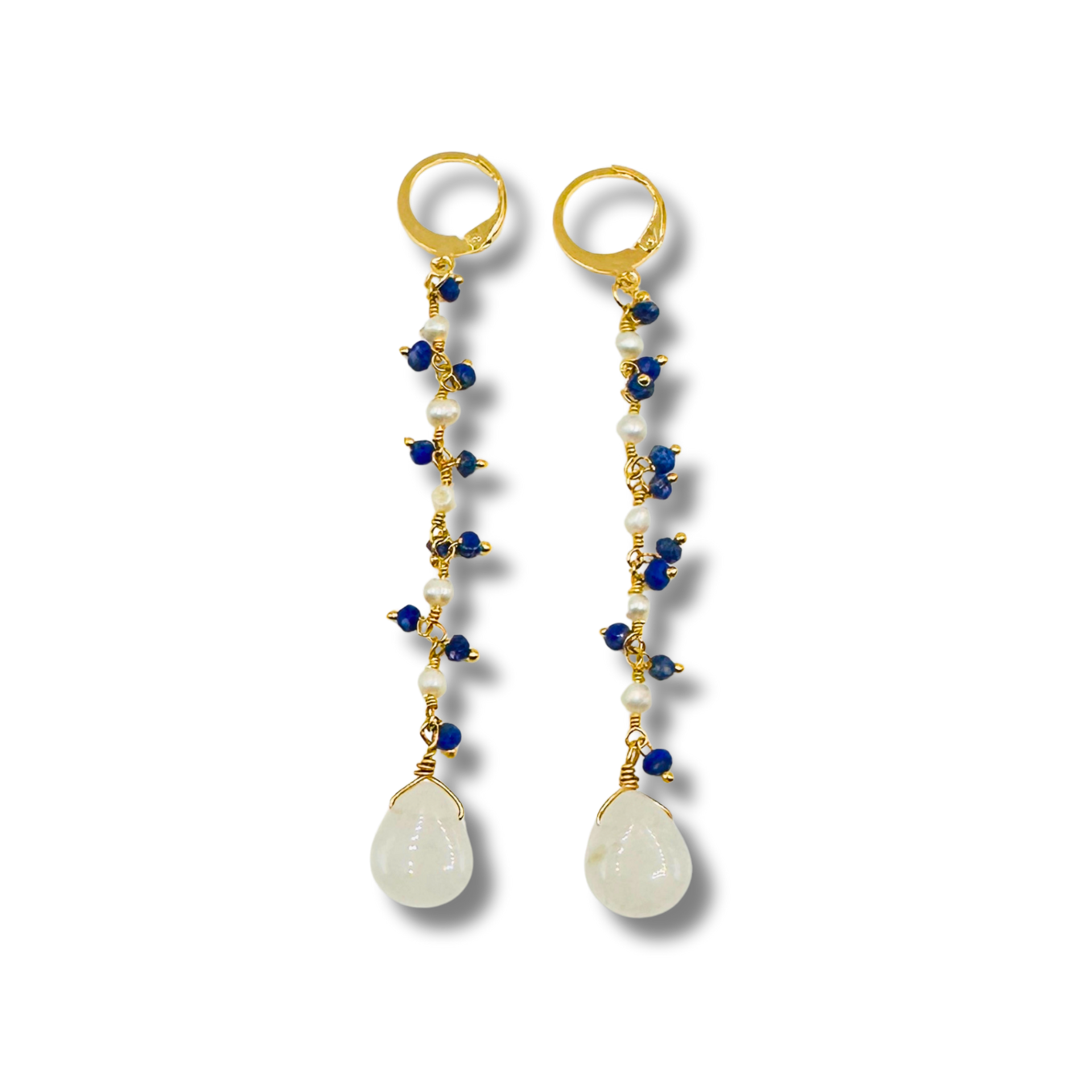 Pair of earrings with gold loops, blue and white beads, and teardrop-shaped stones on a white background.