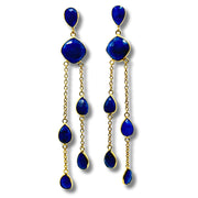 A pair of blue lapis bezel set stone earrings with gold plating on brass hooks.