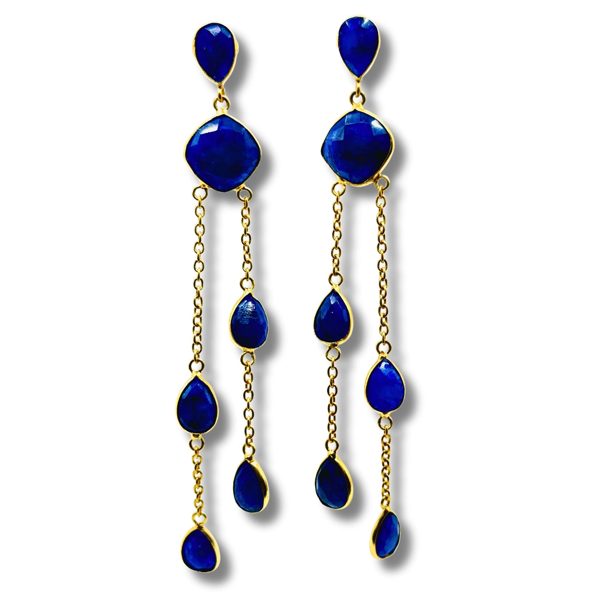 A pair of blue lapis bezel set stone earrings with gold plating on brass hooks.