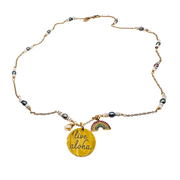 Necklace with 'live aloha' pendant and rainbow charm on a white background