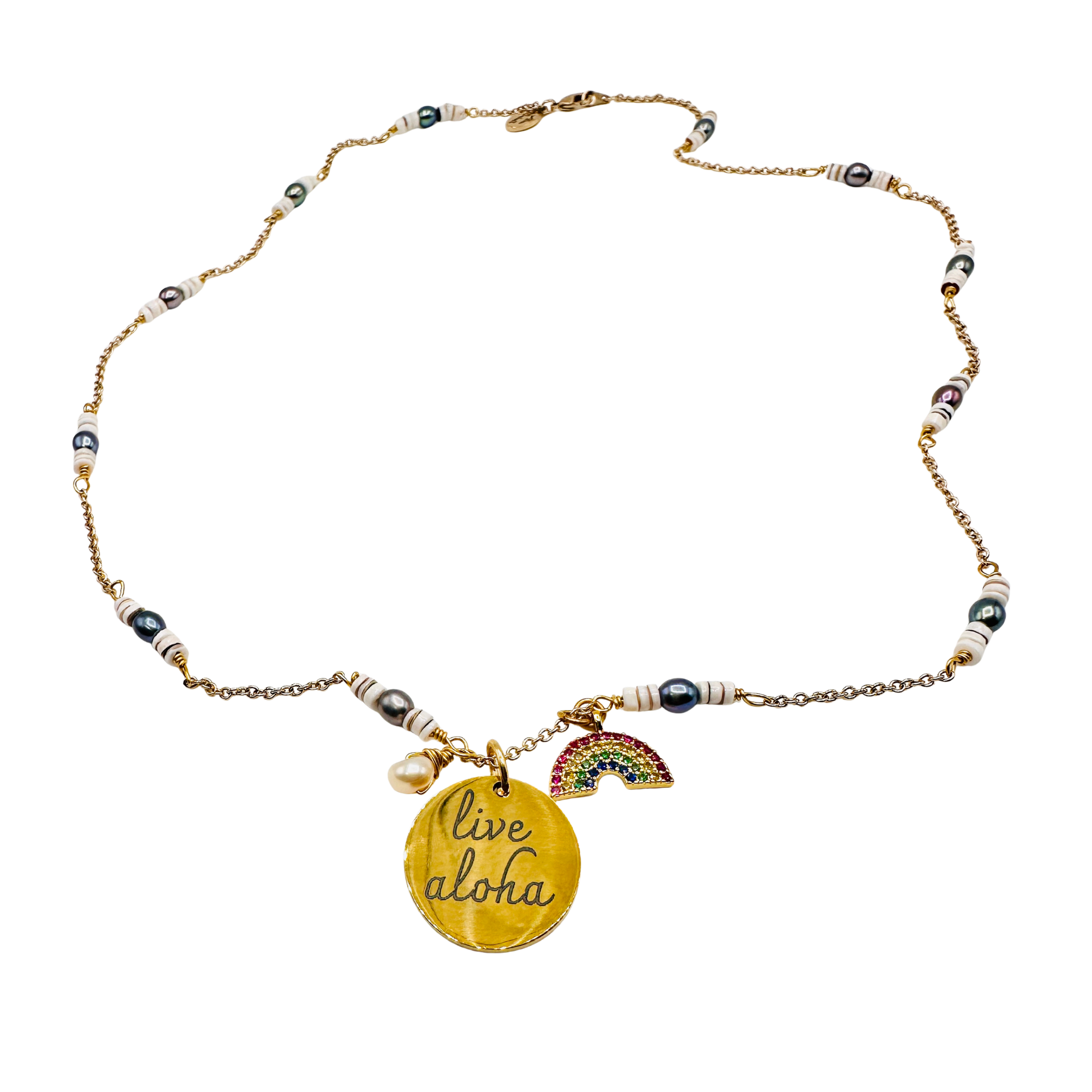 Necklace with 'live aloha' pendant and rainbow charm on a white background