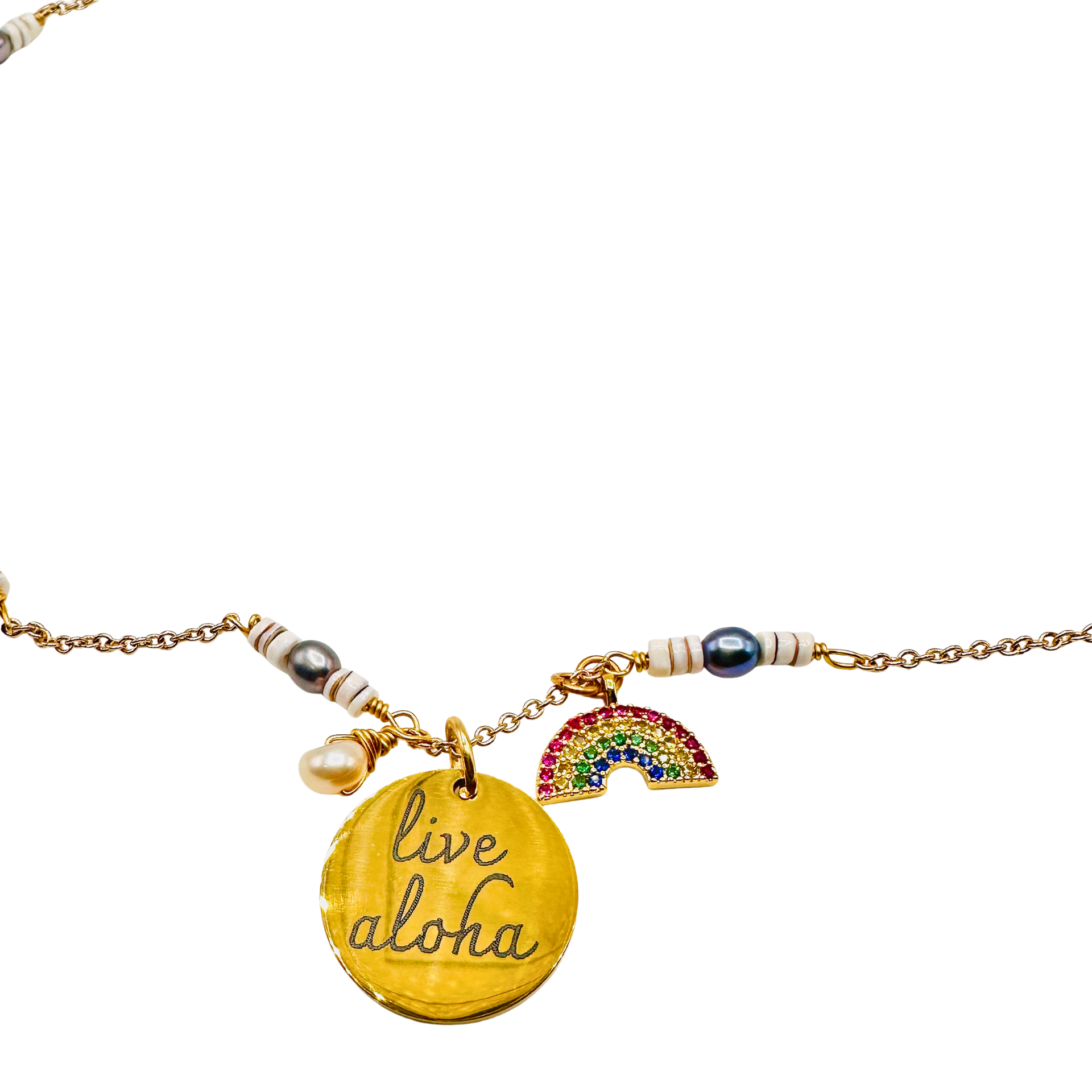 Necklace with 'live aloha' pendant and rainbow charm on a white background