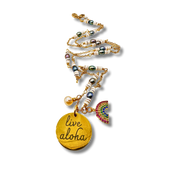 Necklace with 'live aloha' pendant and rainbow charm on a white background