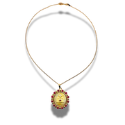 Gold necklace with a pendant on a white background
