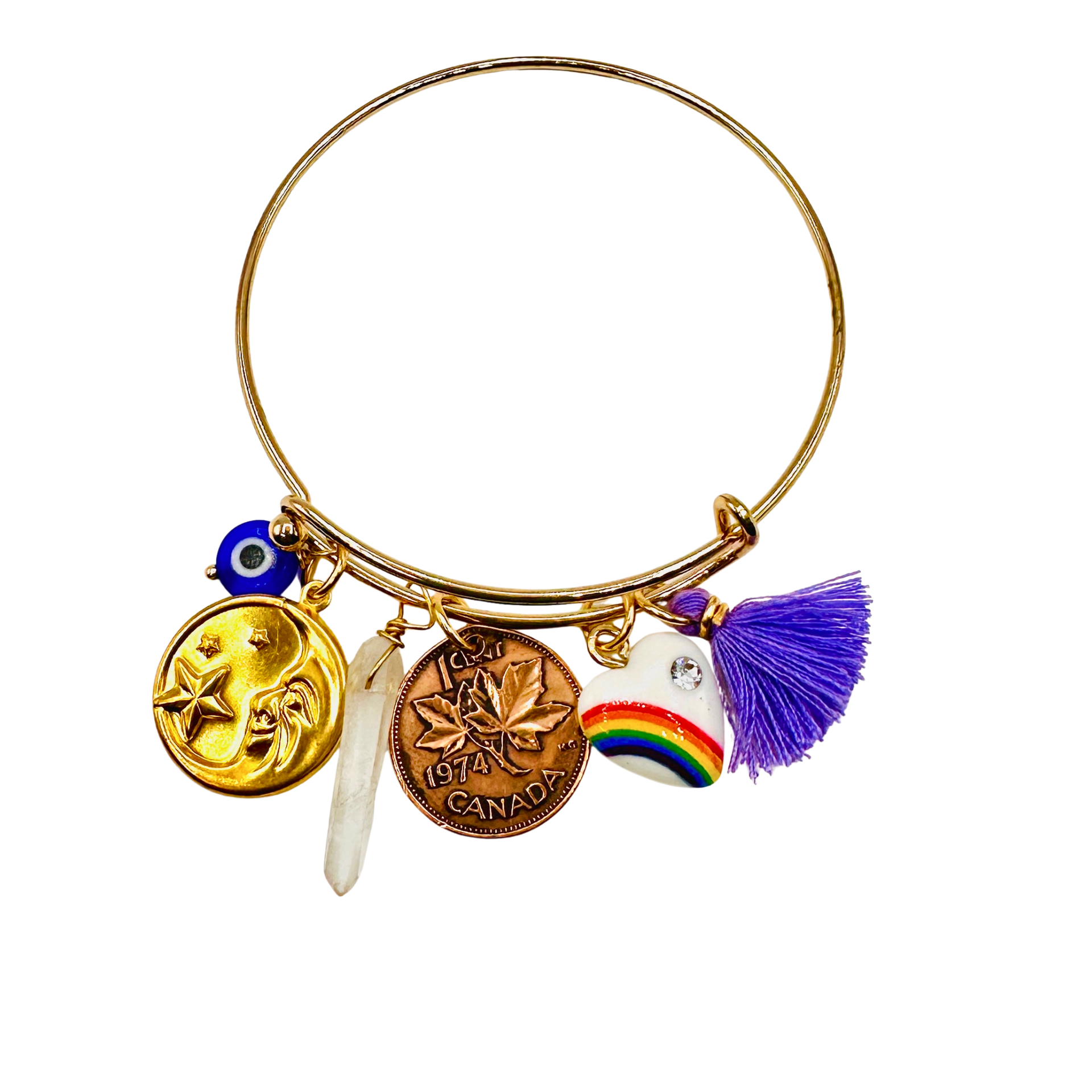 Gold bracelet with various charms on a white background