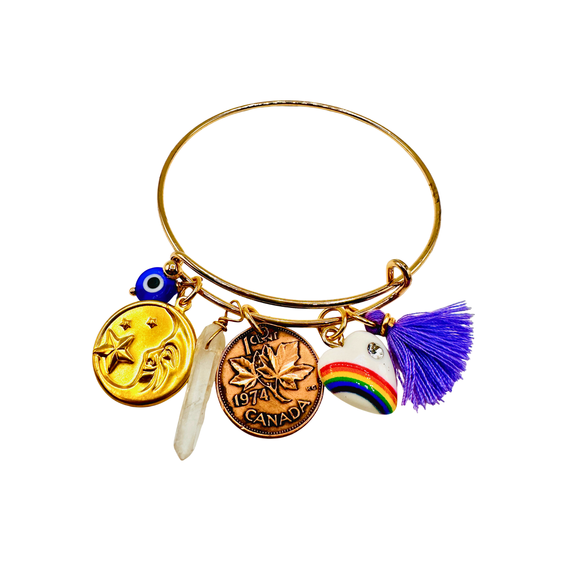 Gold bracelet with various charms on a white background