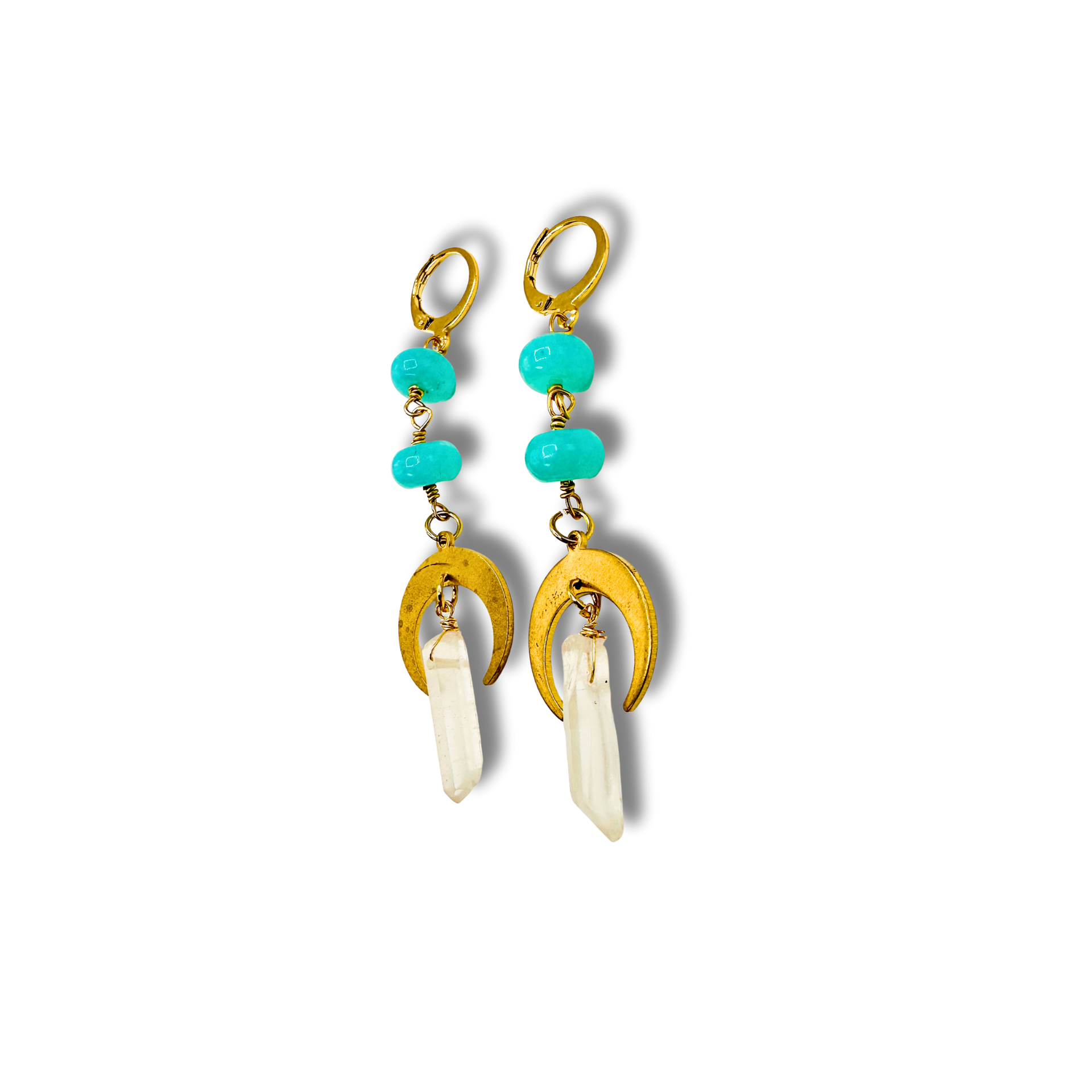 Gold earrings with turquoise beads and white stones on a white background