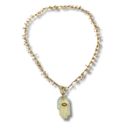 Necklace with a hand-shaped pendant on a white background