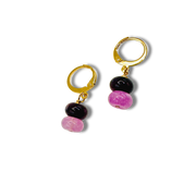 Pair of hoop earrings with black and pink beads on a white background