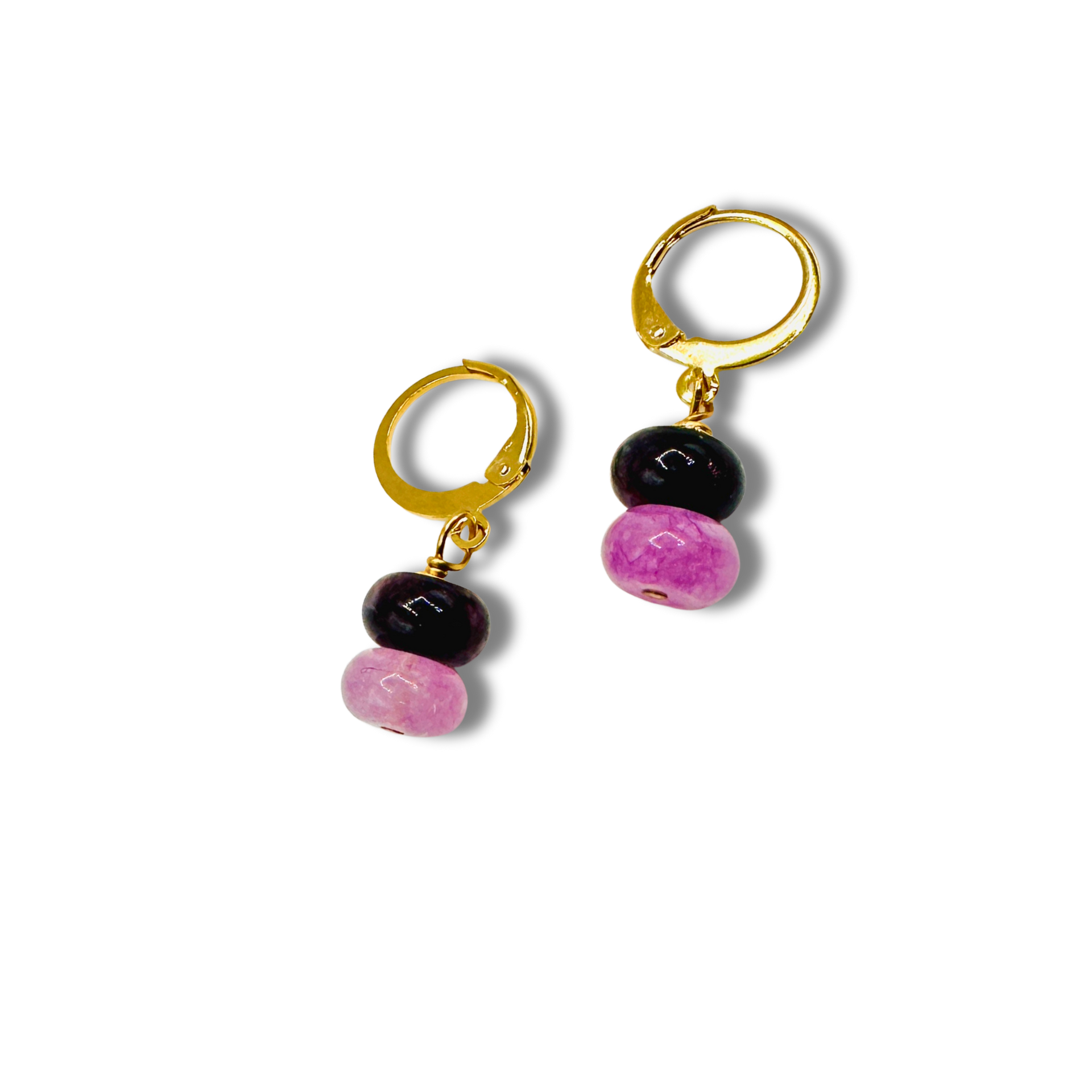 Pair of hoop earrings with black and pink beads on a white background