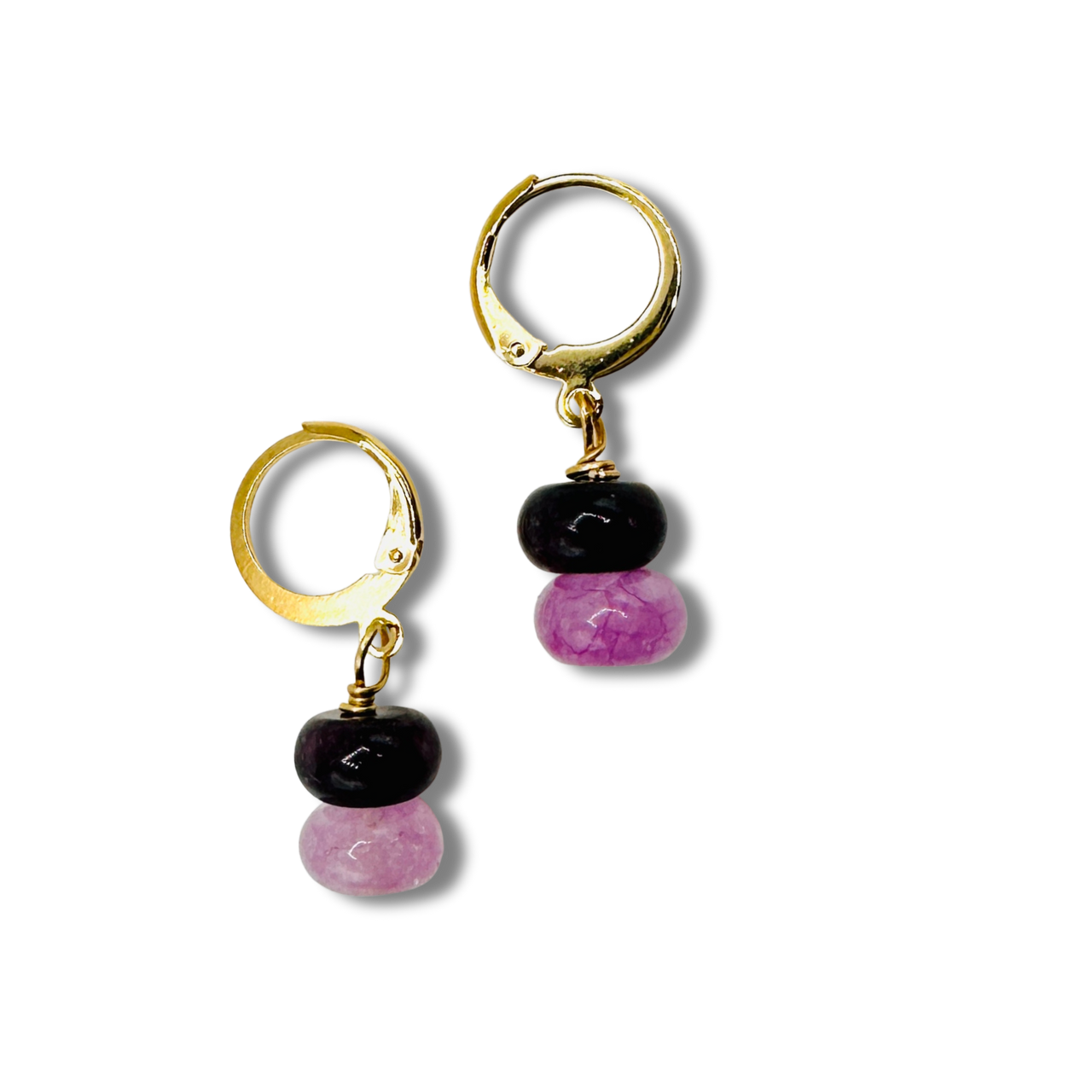 Pair of gold hoop earrings with black and pink beads on a white background
