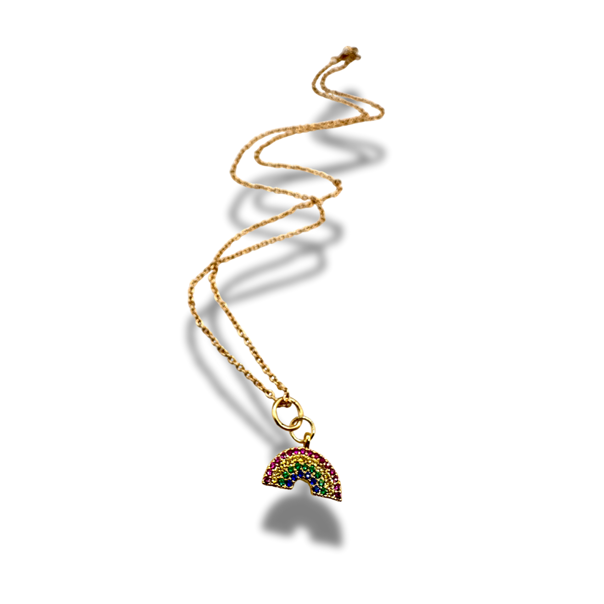 Gold necklace with a colorful rainbow pendant on a white background