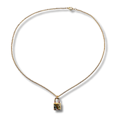 Gold necklace with a pendant on a white background