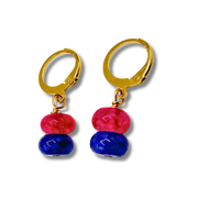 Pair of gold hoop earrings with pink and blue beads on a white background