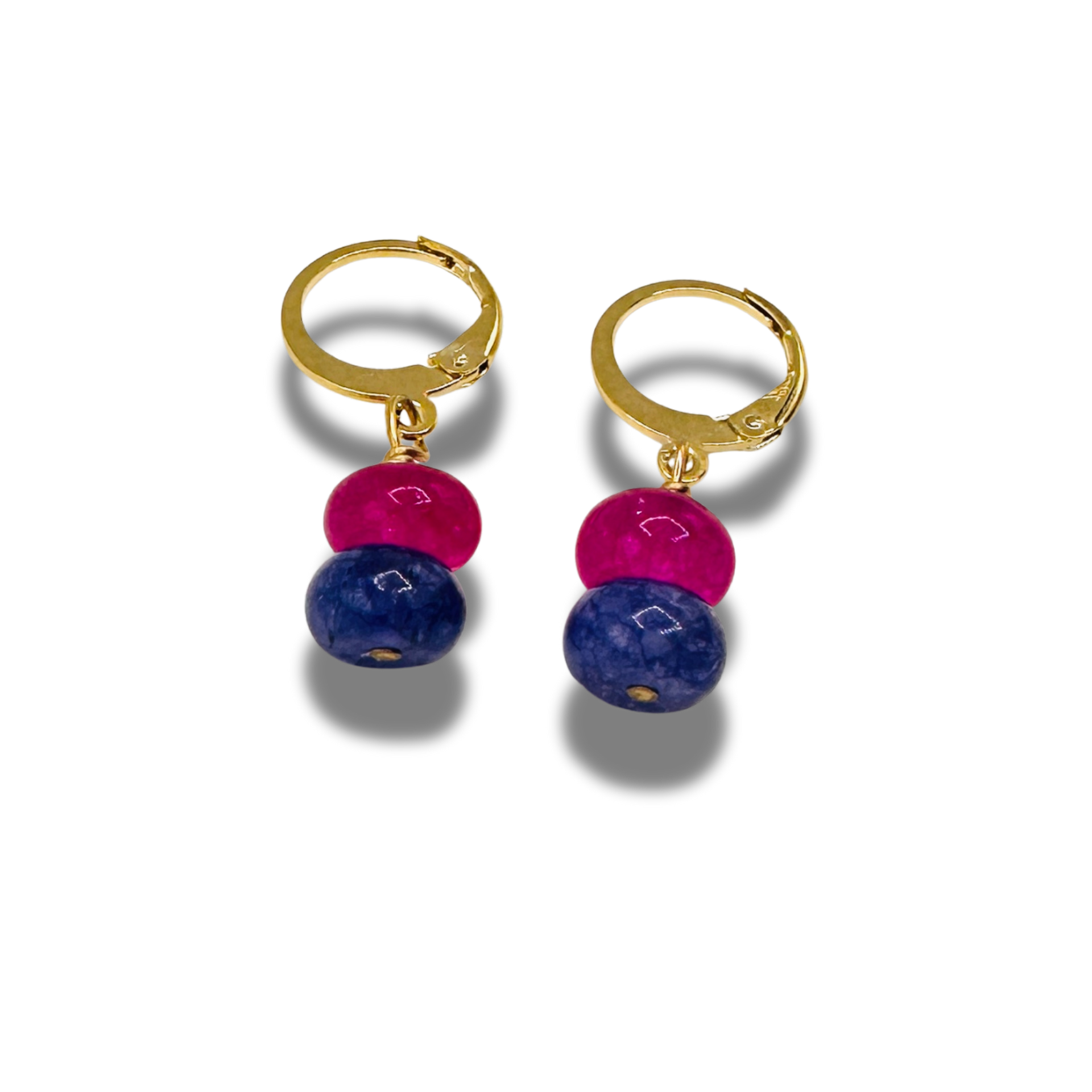 Gold hoop earrings with pink and blue beads on a white background