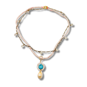 Necklace with beads and a pendant on a white background