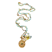 Necklace with beaded chain and decorative pendants on a white background